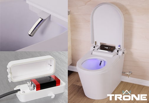A photo of Trone toilet, battery, and cleaning nozzle.